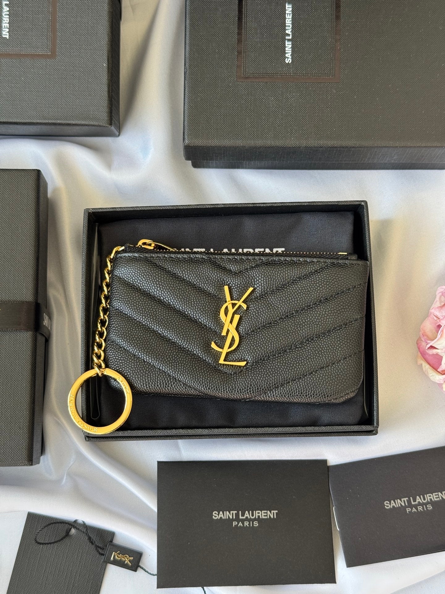 YSL Cassandre Matelass¨¦ calfskin leather key pouch in black with chevron stitching and silver-toned logo