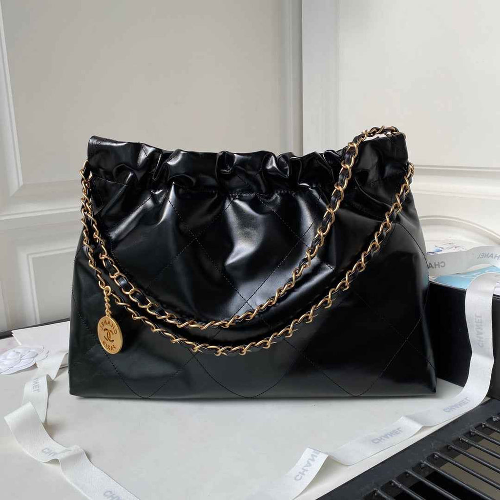 Chanel 22 Handbag AS4486 Calfskin In Black Gold