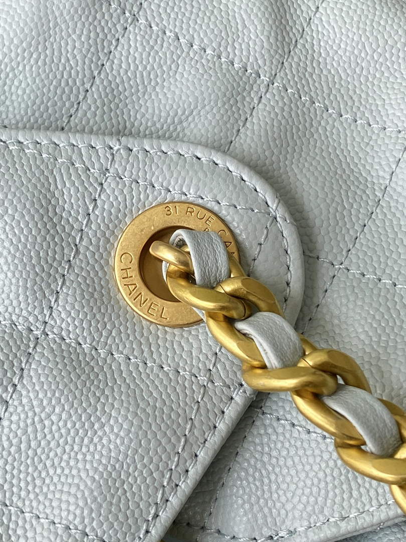 Chanel 25 medium handbag, AS5311 grained calfskin blue