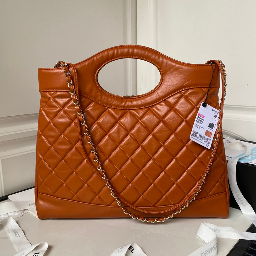 Chanel 31 Large shopping bag AS1010 Shiny Calfskin Brown