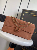 Chanel Maxi flap bag in dark beige suede featuring gold-tone chain strap and CC turn-lock closure, model AS6281.