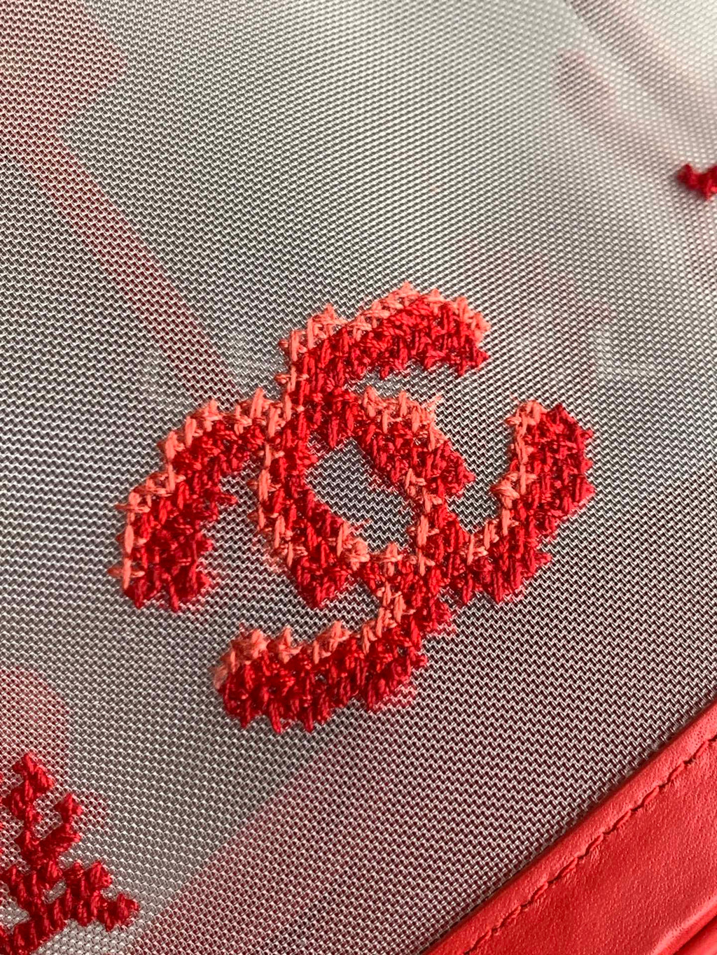 Chanel Large Bucket Bag in black mesh and calfskin leather, model AS6194, featuring a drawstring closure and signature interwoven chain strap.