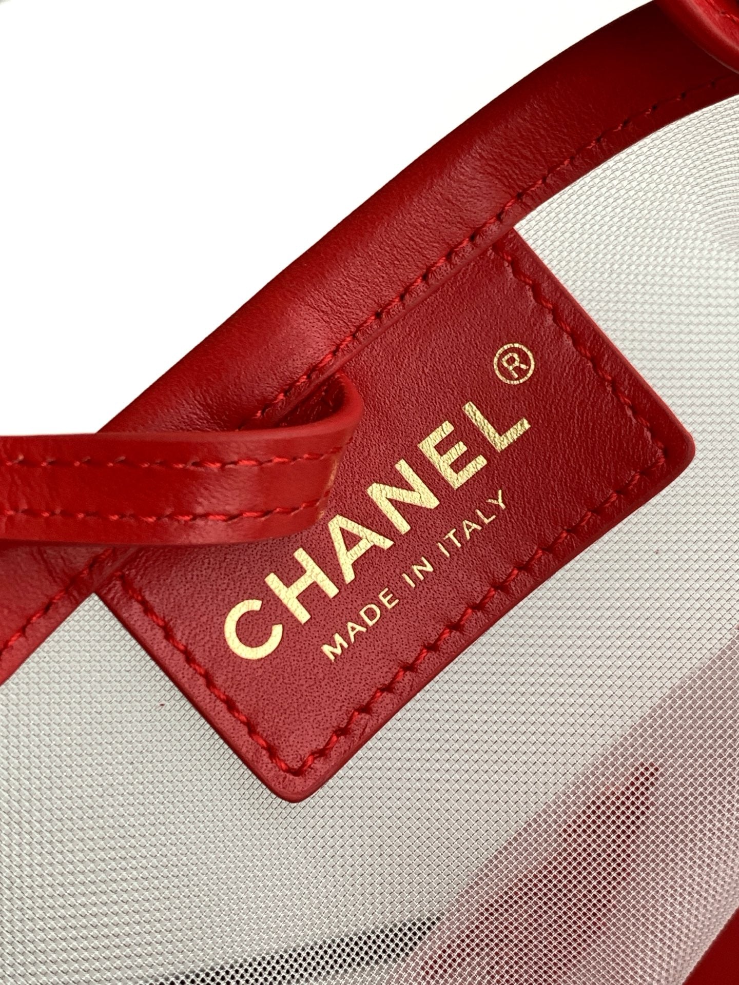 Chanel Large Bucket Bag in black mesh and calfskin leather, model AS6197, featuring a drawstring closure and signature interwoven chain strap.