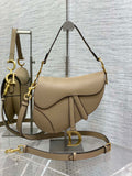6. Dior Saddle Bag with strap paired with summer dress and sandals