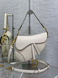 6. Dior Saddle Bag M0455 worn crossbody on a casual white outfit