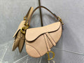 6. Dior M0455 Saddle Bag carried by hand in an urban street style look
