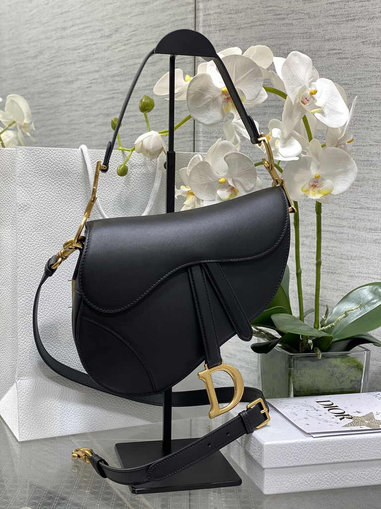 31. Dior Saddle Bag M0455 placed on a marble surface studio shot