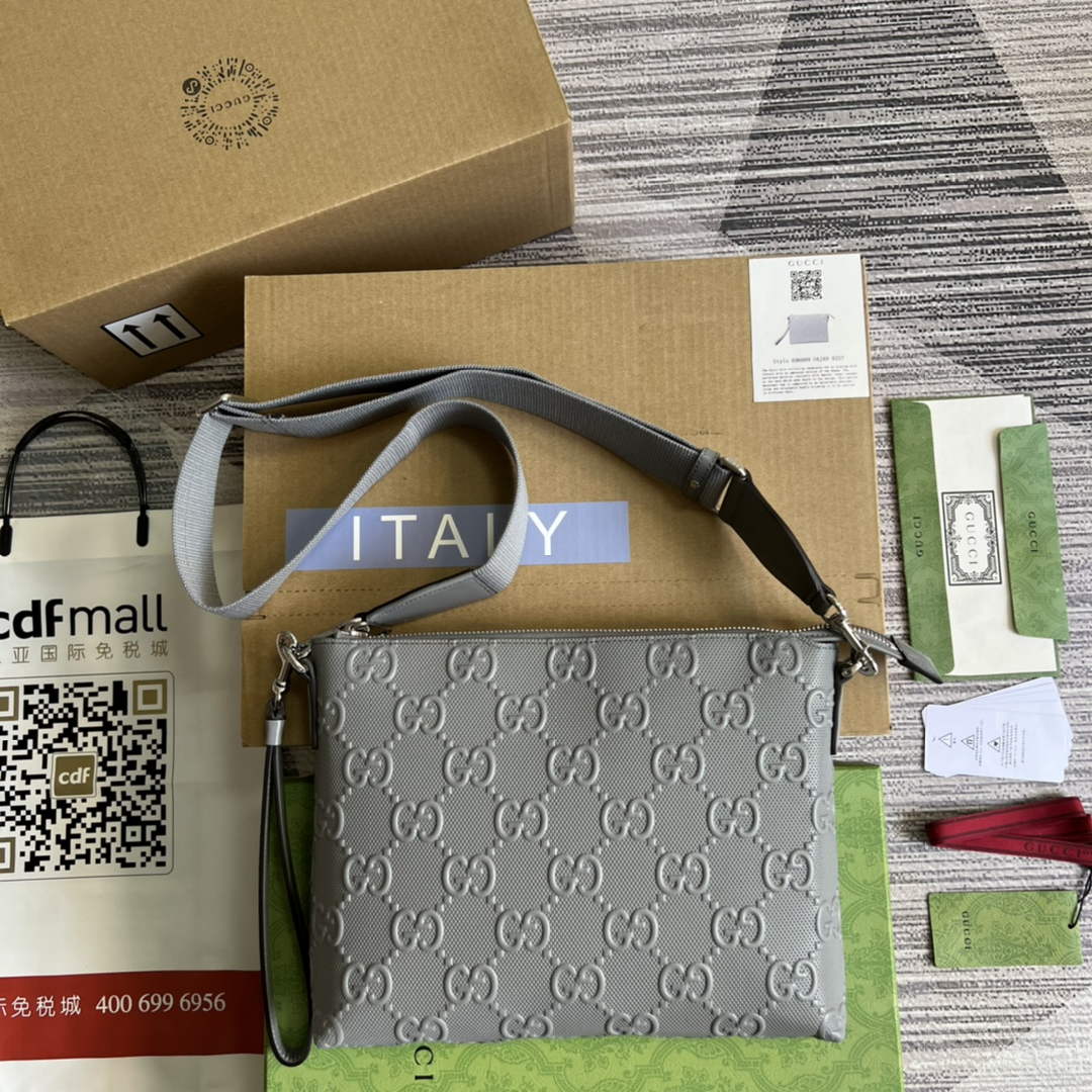 Gucci 696009 GG embossed medium messenger bag gray