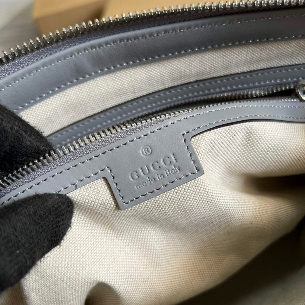 Gucci 696009 GG embossed medium messenger bag gray