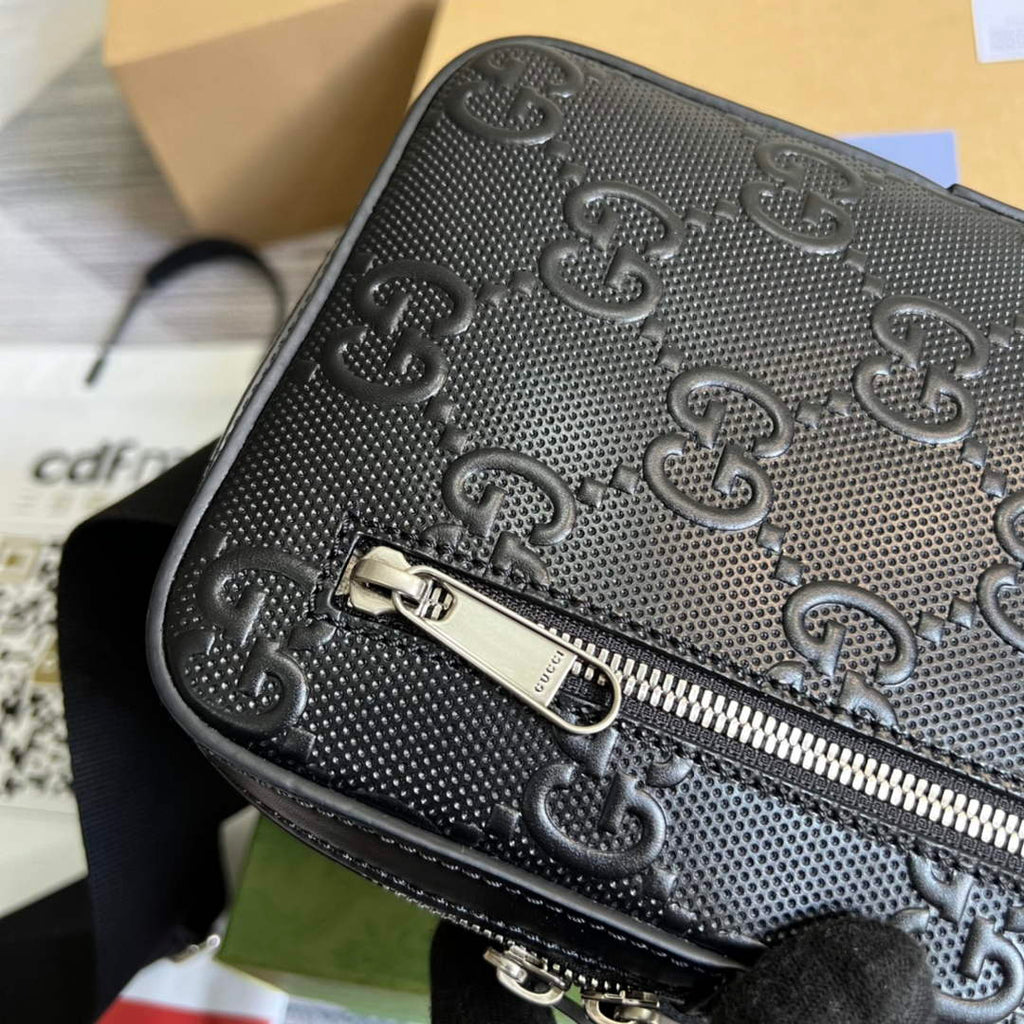 Gucci ‎700431 GG embossed sling backpack black