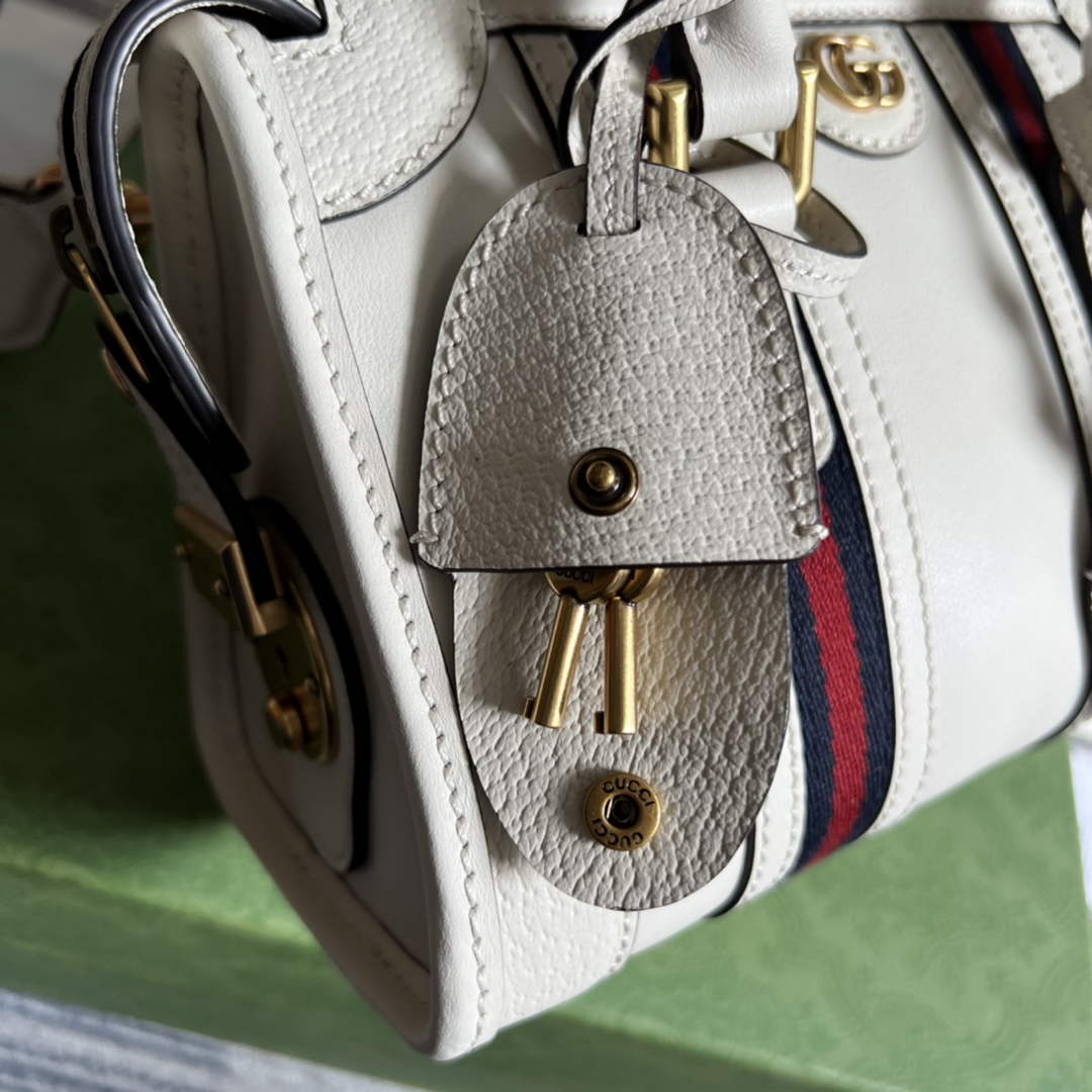 Gucci 715771 Mini canvas top handle bag White leather