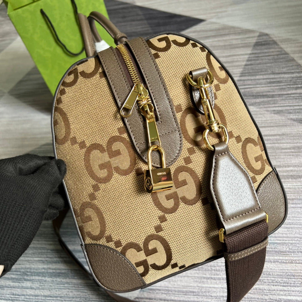 Gucci 724642 Jumbo GG small duffle bag in camel and ebony GG canvas