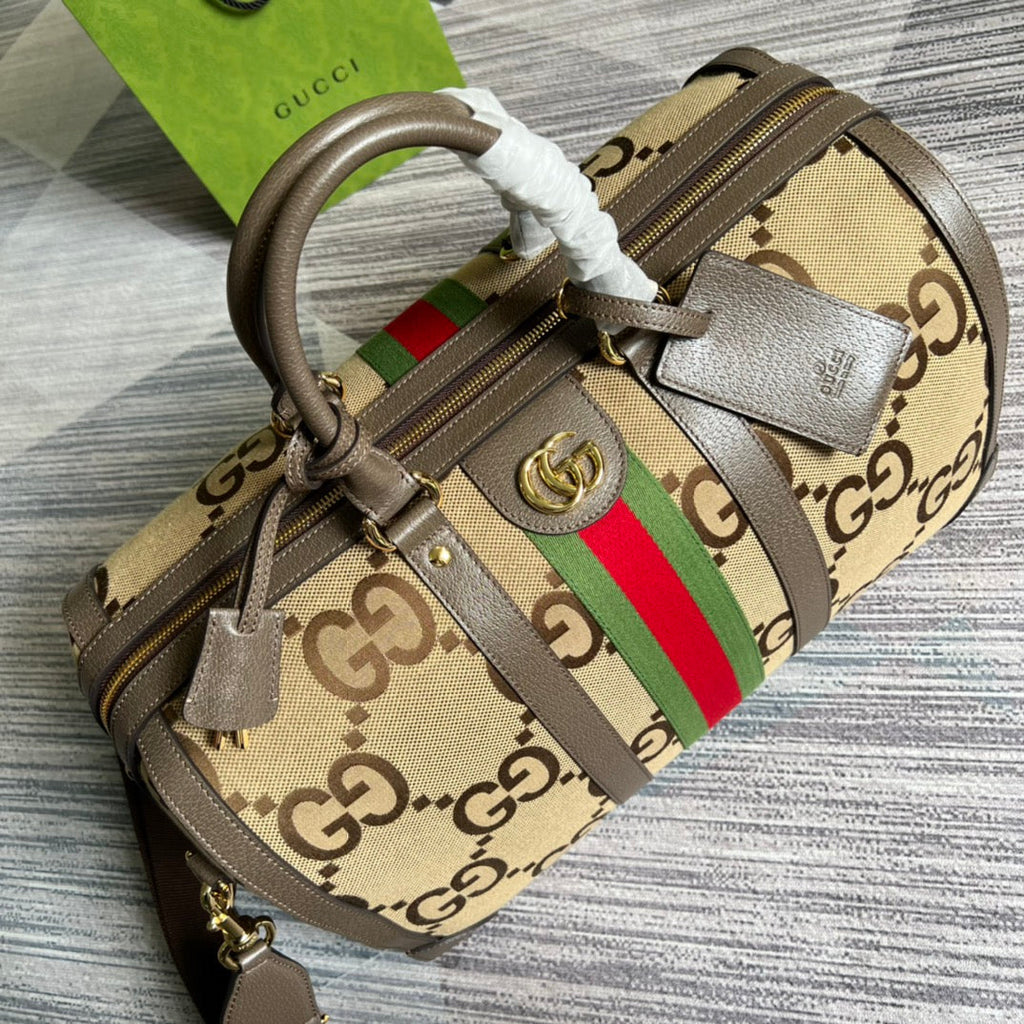 Gucci 724642 Jumbo GG small duffle bag in camel and ebony GG canvas