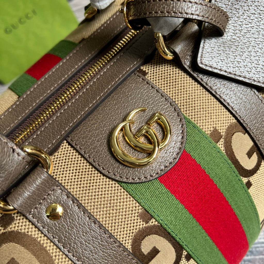 Gucci 724642 Jumbo GG small duffle bag in camel and ebony GG canvas