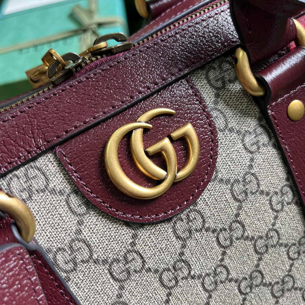 Gucci 724642 Mini GG canvas small duffle bag in Burgundy leather