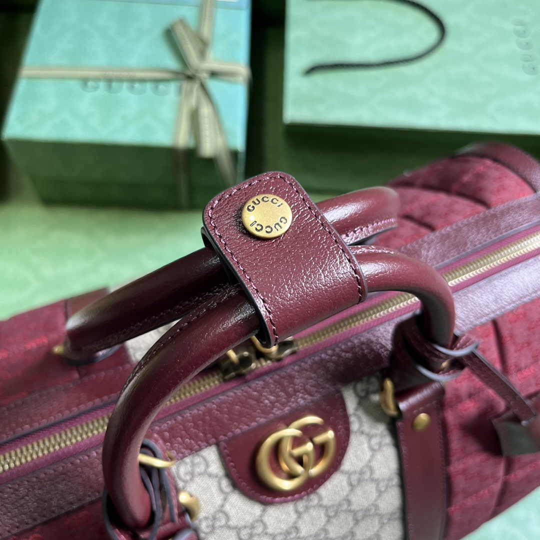 Gucci 724642 Mini GG canvas small duffle bag in Burgundy leather