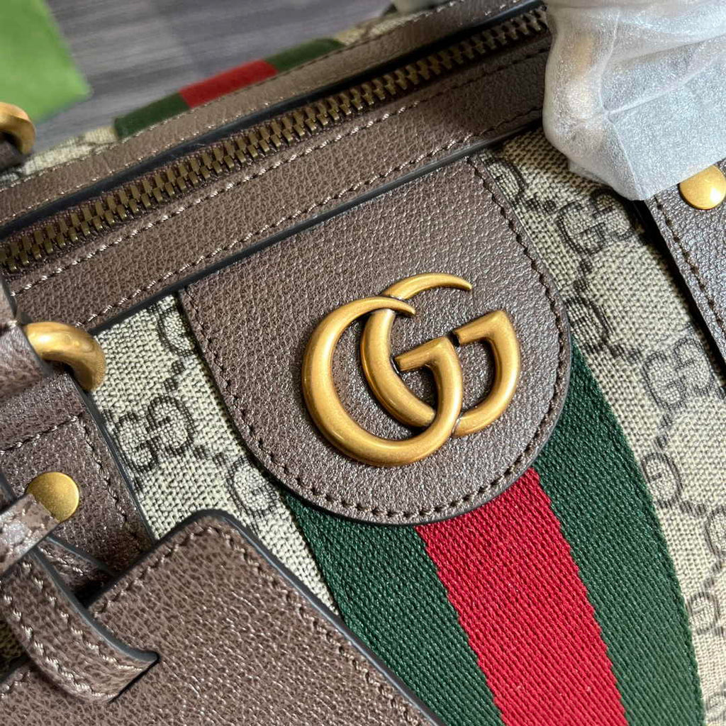 Gucci 724642 Savoy small duffle bag in beige and ebony Supreme