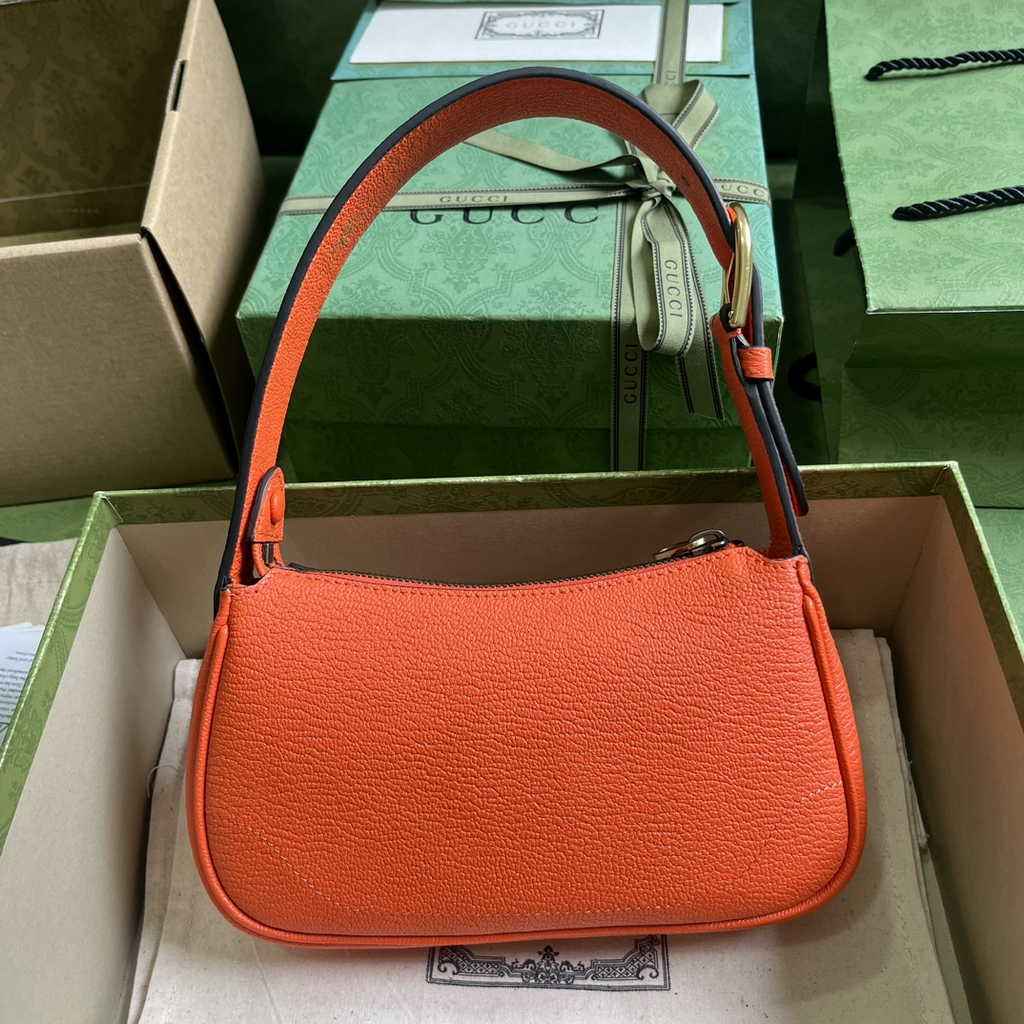 Gucci 739076 Aphrodite mini shoulder bag in orange leather