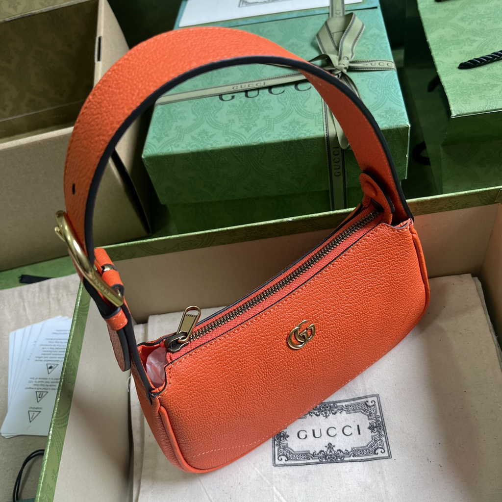Gucci 739076 Aphrodite mini shoulder bag in orange leather