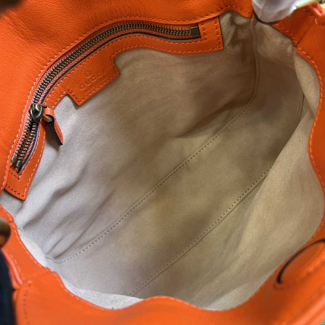 Gucci 746251 Diana small shoulder bag in orange leather