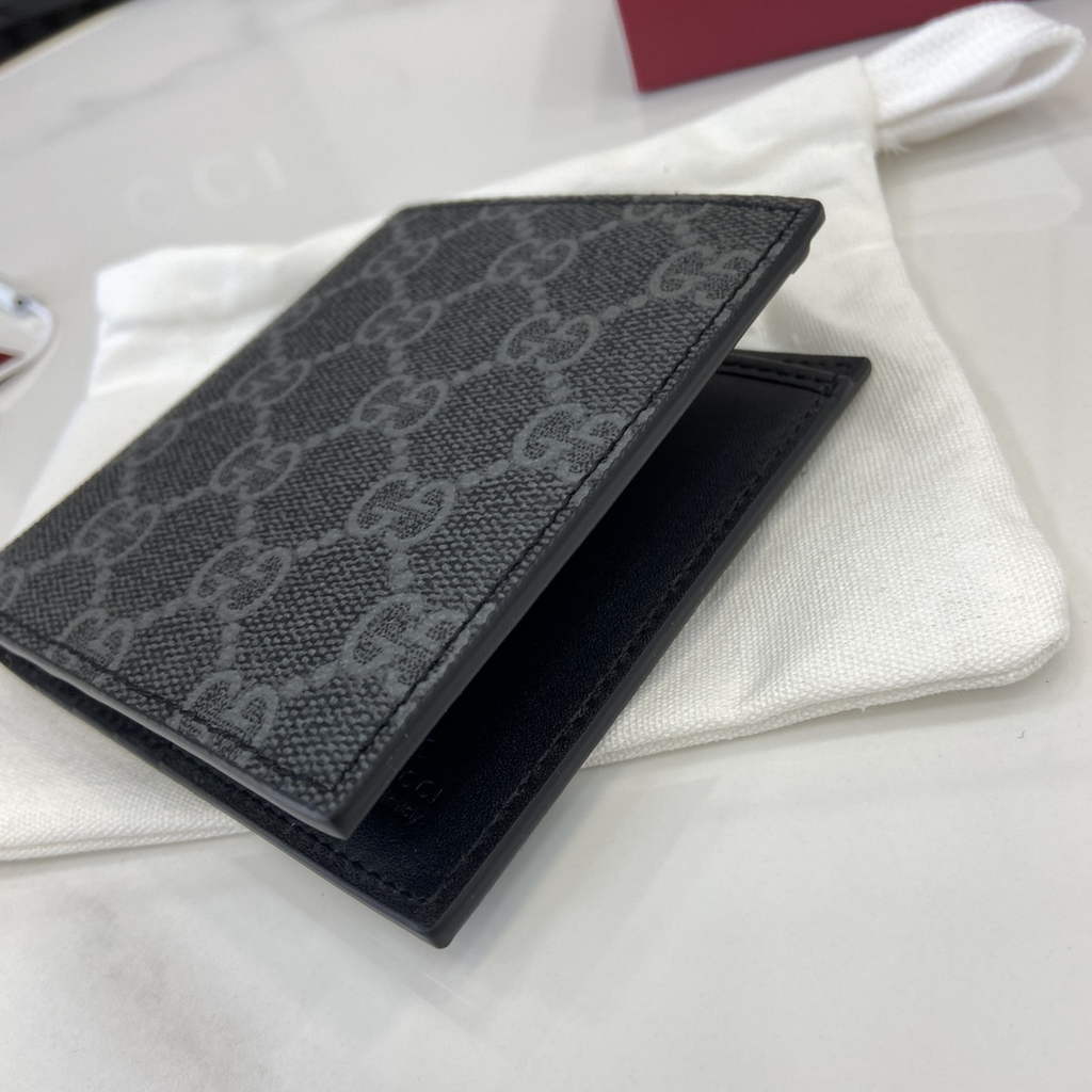 Gucci GG Emblem bi-fold wallet, 821206 in black fabric