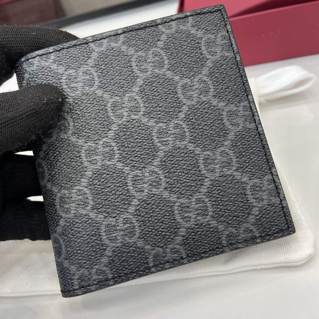Gucci GG Emblem bi-fold wallet, 821206 in black fabric