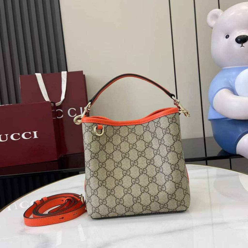Gucci GG Emblem small bucket bag 815118 in orange fabric