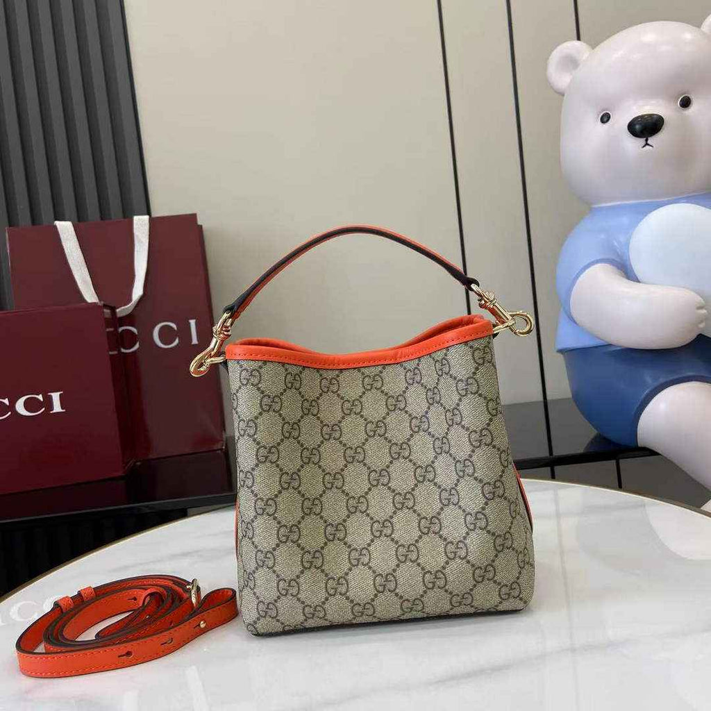 Gucci GG Emblem small bucket bag 815118 in orange fabric