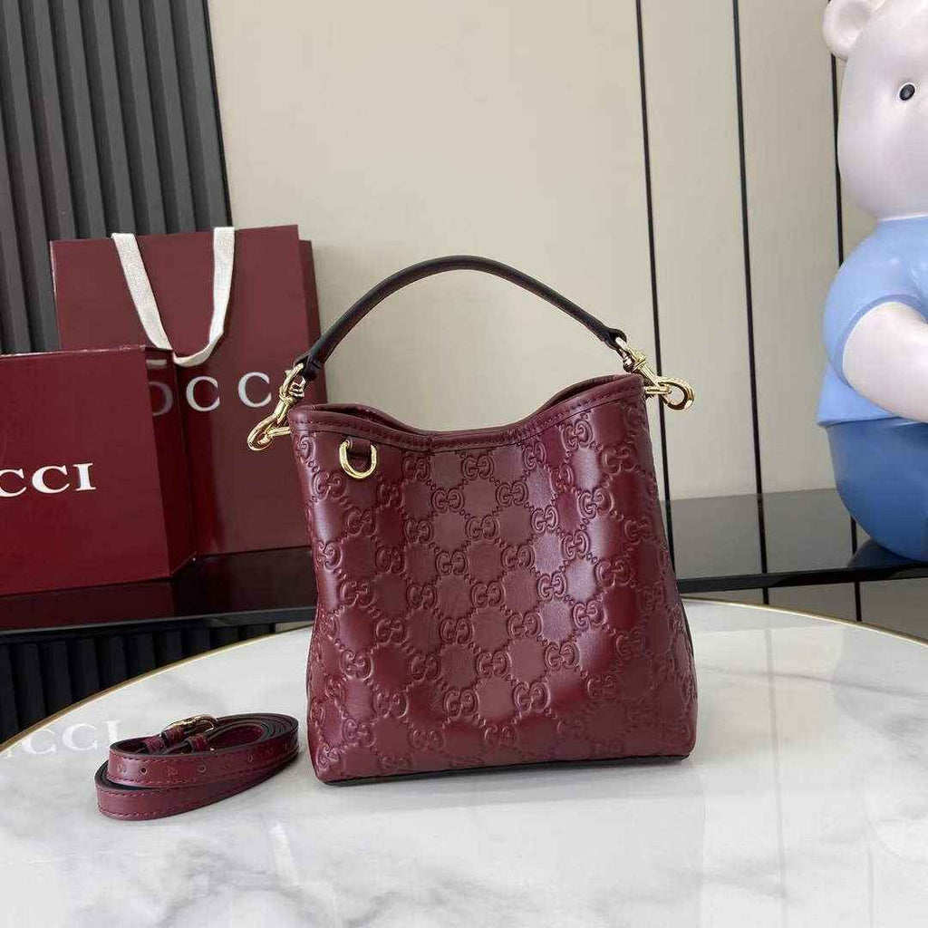 Gucci GG Emblem small bucket bag 815118 in GG wine red leather