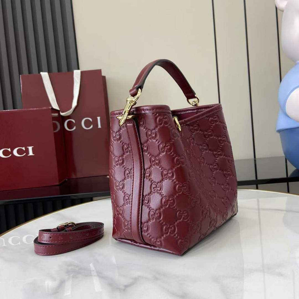 Gucci GG Emblem small bucket bag 815118 in GG wine red leather