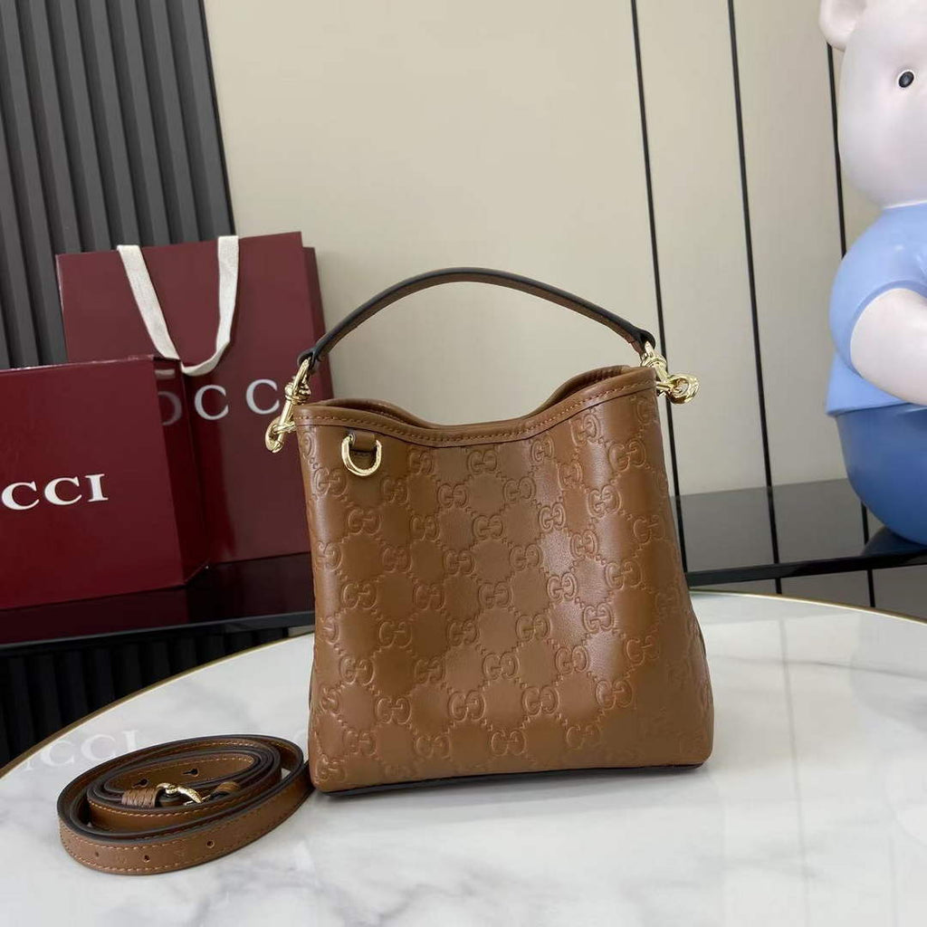 Gucci GG Emblem small bucket bag 815118 in GG brown leather
