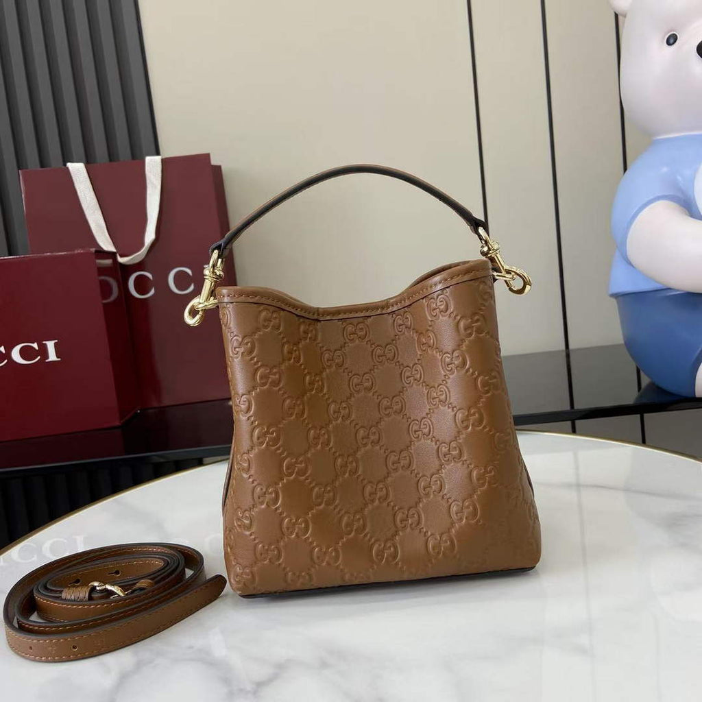 Gucci GG Emblem small bucket bag 815118 in GG brown leather