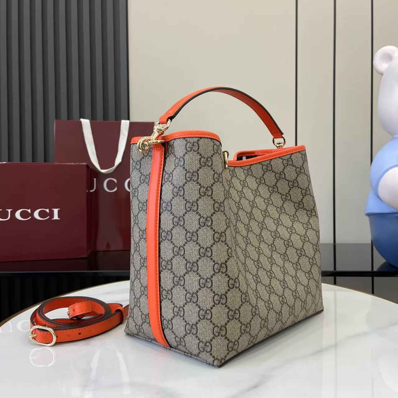 Gucci GG Emblem medium bucket bag ‎815103 in orange fabric