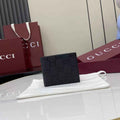Gucci Imprint bi-fold wallet - Black GG Leather 835001