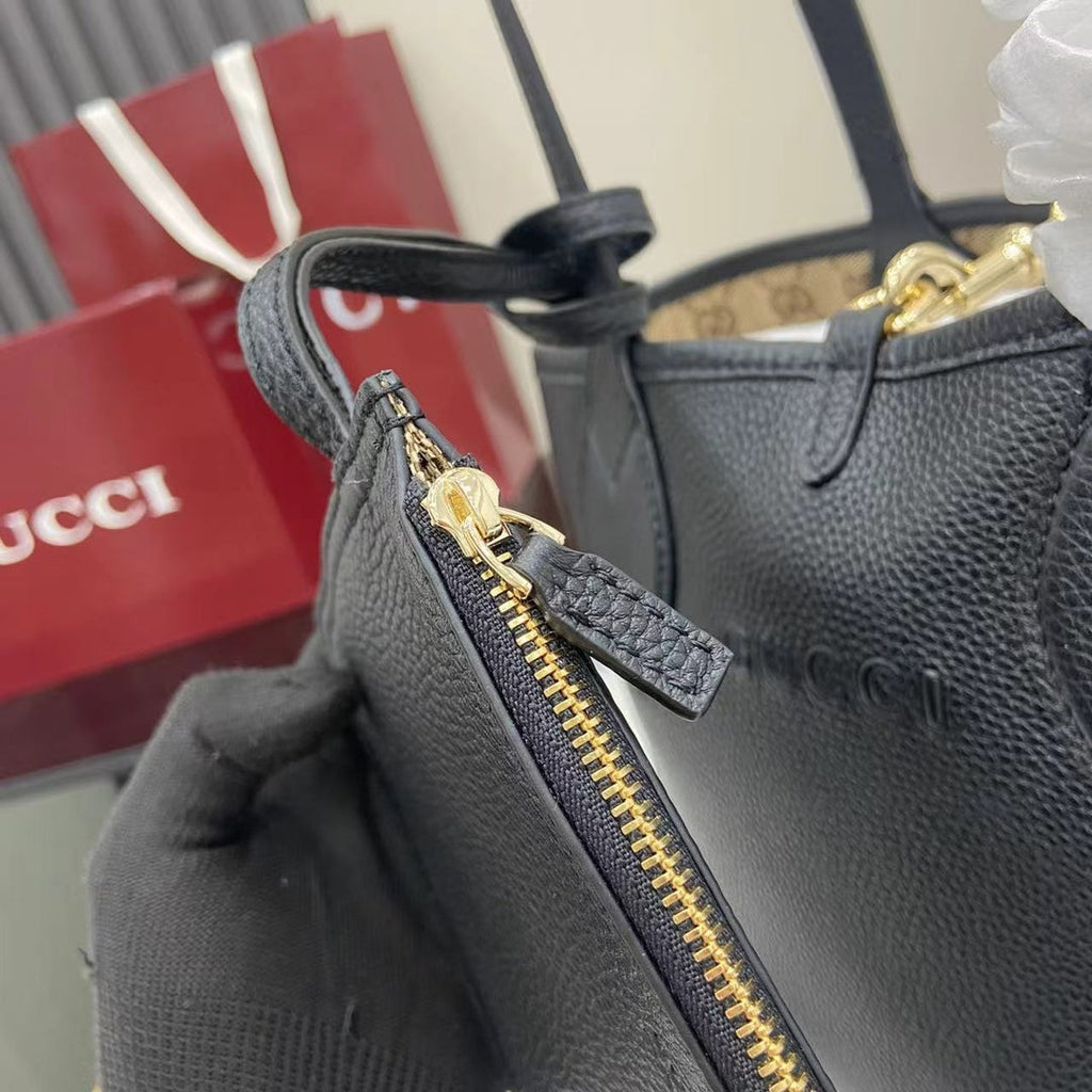 Gucci Totissima small reversible tote bag in black leather ‎839124
