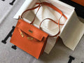 Hermès Kelly Danse II orange Evercolor leather with gold