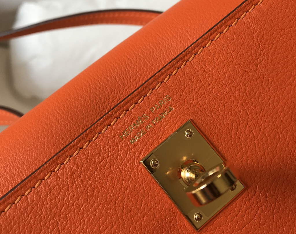 Hermès Kelly Danse II orange Evercolor leather with gold