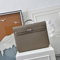 Front view of Herm¨¨s Kelly D¨¦p¨ºche 36 satchel briefcase ¨C Togo leather, palladium hardware, removable shoulder strap