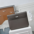 Herm¨¨s Kelly D¨¦p¨ºche 36 inside an orange gift box with ribbon ¨C ideal heritage gift for executives
