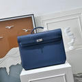 Sunlight casting shadows over grained Togo leather of Herm¨¨s Kelly D¨¦p¨ºche 36 ¨C quiet luxury aesthetic