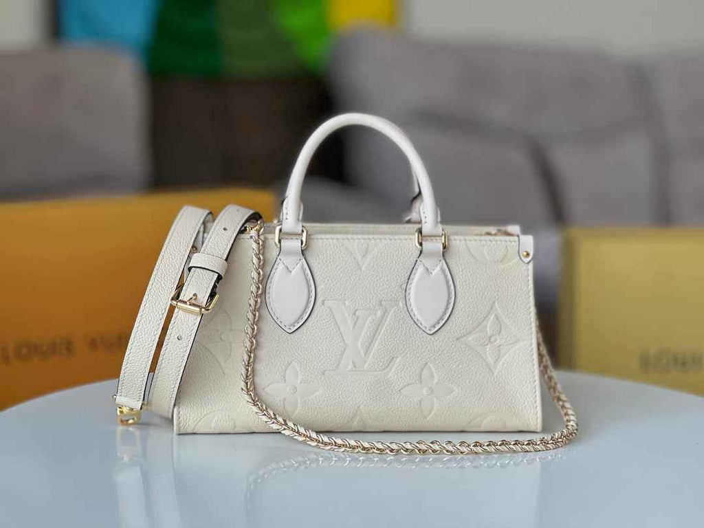 LV M23698 Louis Vuitton OnTheGo East West Monogram Empreinte Leather Cream - Default Title - View 1