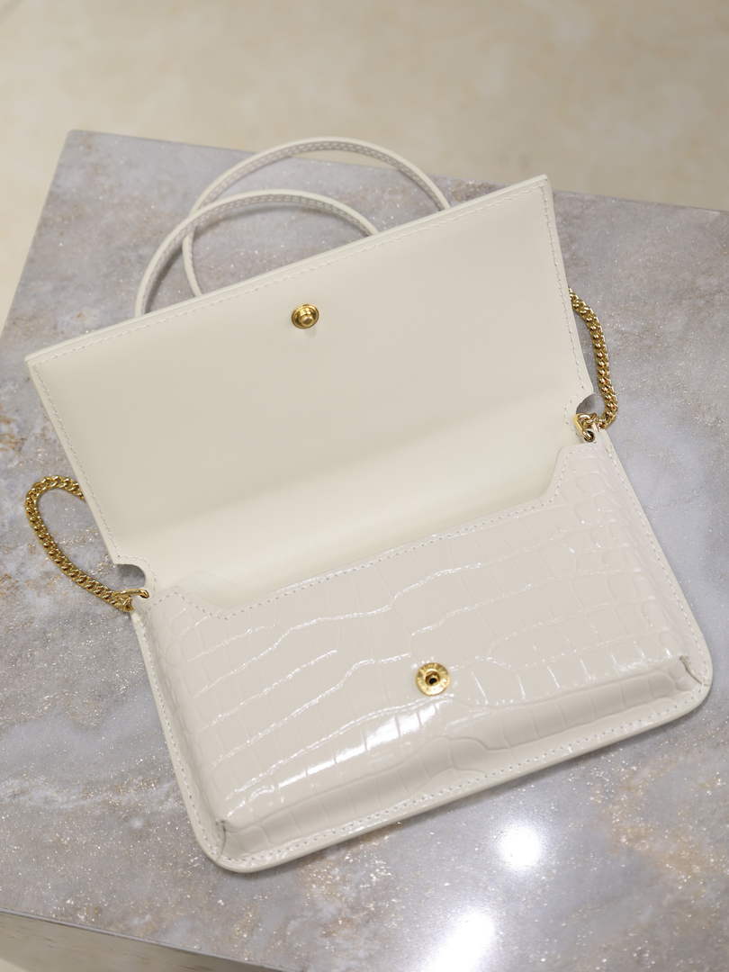 YSL CASSANDRE phone holder 635095 in SHINY crocodile-embossed leather white